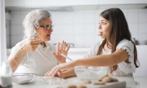 Gramma Telling Young Girl House Cleaning Tips.