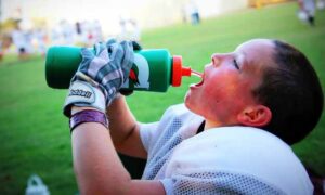 Young Boy Football and How to Remove Sweat Stains