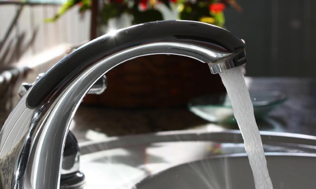 Clean Kitchen Faucet After Hard Water Spots Were Removed.